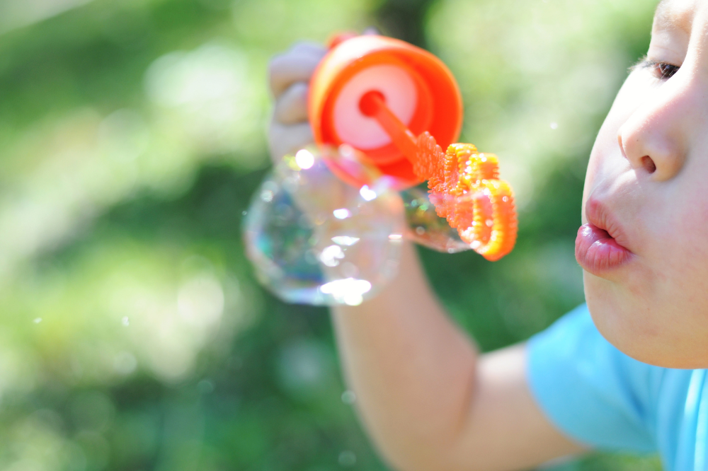 Child blowing bubbles