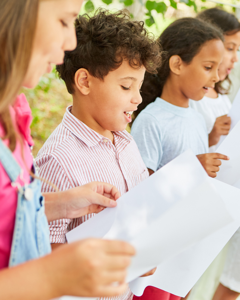 Children singing from sheets